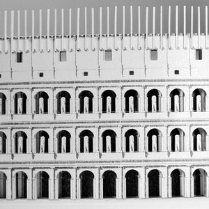 Assembled 3d scale model of the Roman Colosseum. The model of the ancient oval amphitheatre is made out of printed paper parts, the graphics feature external wall colonades and corridors.