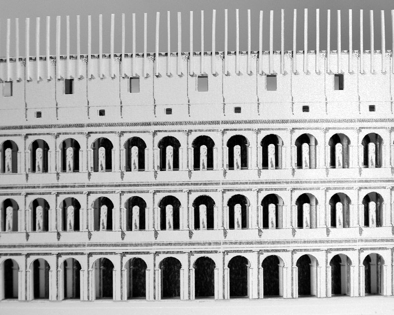 Assembled 3d scale model of the Roman Colosseum. The model of the ancient oval amphitheatre is made out of printed paper parts, the graphics feature external wall colonades and corridors.