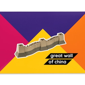 Product packaging for the Great Wall of China paper model kit. A bright coloured cardstock envelope features four large triangles in yellow, magenta, purple and orange with an image of a finished model at the centre and the product title below.