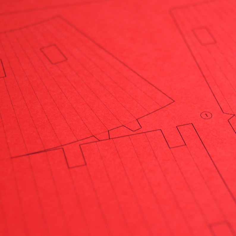 Closeup of the paper worksheet with printed parts to be cut out for making a scale model of the Torii Gate.