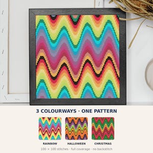 May include: A framed cross-stitch pattern featuring a vibrant rainbow wave design. Below, the text reads 3 COLOURWAYS ONE PATTERN, with three smaller square swatches labeled RAINBOW, HALLOWEEN, and CHRISTMAS, noting 100 x 100 stitches, full coverage, no backstitch.