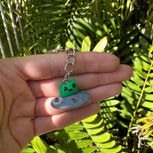 Alien buddies in a UFO handmade polymer clay keychain or phone bag charm