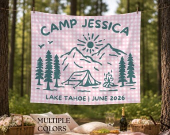 May include: A pink and white gingham patterned banner with the text "CAMP JESSICA" in teal. Below the text is a mountain and forest scene with a tent and campfire. The banner also reads "LAKE TAHOE | JUNE 2026".