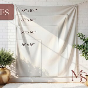 May include: A white wall tapestry with size options displayed: 88" x 104", 68" x 80", 50" x 60", and 26" x 36". The word "SIZES" is in the upper left corner. The tapestry is hanging on a white brick wall, with plants in the foreground.