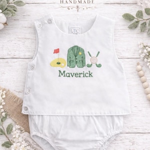 May include: A set of three ceramic mugs with a speckled, matte finish. The mugs are in shades of cream, light gray, and dark gray. Each mug has a simple, minimalist design and a rounded handle.