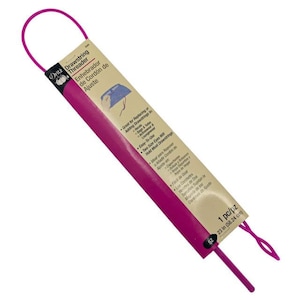 May include: A pink drawstring threader tool with a white label that reads "Oritz Drawstring Threader" and "Enhebrador de Cordón de Ajuste". The label also includes instructions for using the tool and lists its features: "Great for Replacing or Adding Drawstrings in Hoods, Bags & Loungewear", "Easy-To-Use", "Two Size Eyes Will Hold Most Drawstrings". The tool is 23 inches long.