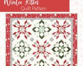 The Winter Kisses Quilt by Beverly McCullough of Flamingo Toes is Rolie Polie friendly. Finished size is 59" x 75" - Paper pattern