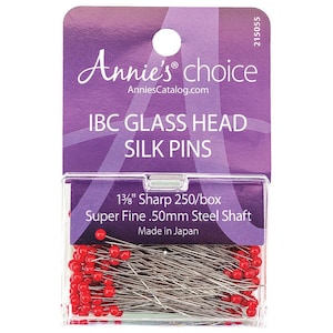 May include: A box of 250 red glass head silk pins with a 1 3/8 inch sharp point and a .50mm steel shaft. The box is labeled "Annie's choice" and "IBC Glass Head Silk Pins".