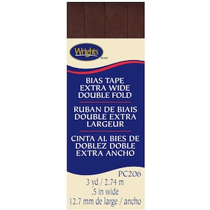 May include: A brown bias tape package with the text "Wrights" and "BIAS TAPE EXTRA WIDE DOUBLE FOLD" on the label. The package also includes the text "RUBAN DE BIAIS DOUBLE EXTRA LARGEUR" and "CINTA AL BIES DE DOBLEZ DOBLE EXTRA ANCHO". The package is labeled with the product number "PC206" and the measurements "3 yd / 2.74 m" and ".5 in wide / 12.7 mm de large / ancho".