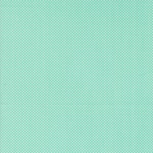 May include: A light turquoise fabric with a white polka dot pattern.