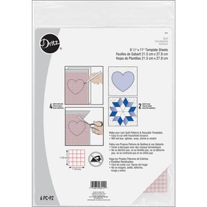 May include: A package of six 8.5 by 11 inch reusable quilting templates. The package shows a variety of quilt patterns including a heart, a star, and a grid. The text on the package reads "Make your own Quilt Patterns & Reusable Templates. Easy to cut with household scissors. Will not tear, splinter, warp, shrink or stretch."