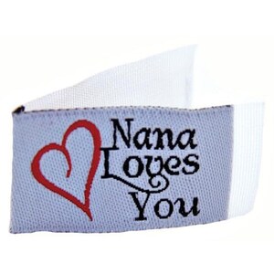 May include: White fabric label with a red heart and the text "Nana Loves You" in black.
