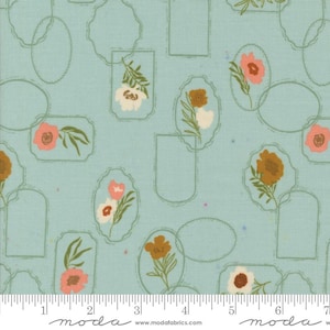 May include: A light blue fabric with a repeating pattern of floral arrangements in decorative frames. The flowers are in shades of pink, white, and brown, with green leaves. The frames are outlined in a light green color. The fabric has a textured appearance.