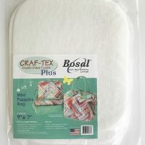 May include: White Craft-Tex Plus fabric for crafting, with the words "Craft-Tex Plus" and "Bosal" printed on the packaging. The packaging also shows a mini zipper bag with a colorful pattern and the words "Mini Zipper Bag 9" x 7" (approx. 23cm x 18cm)".
