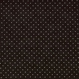 May include: Black fabric with a white polka dot pattern.
