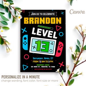 May include: A black and neon green birthday invitation for a 13th birthday party with a video game theme. The invitation features a stylized video game controller and the text "JOIN US TO CELEBRATE BRANDON LEVEL 13". The invitation also includes the date and time of the party, the location, and the RSVP information.