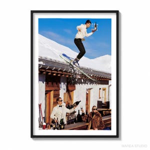 May include: A framed art print featuring a person in a white jacket and black pants skiing off a snowy roof while holding a tray with a bottle and glasses. Below, a person in a white tuxedo pours a drink while another in a fur coat holds a glass.