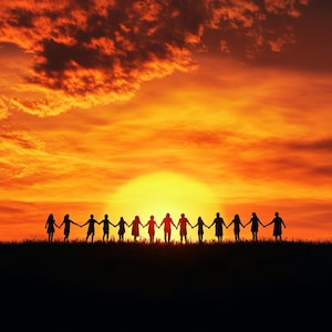 Silhouette of people or community holding hands