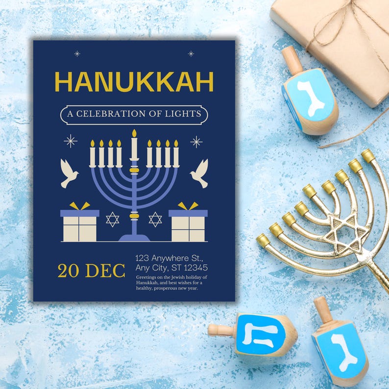 “Festive Hanukkah invitation flat lay with menorah, dreidels, and blue gift boxes on textured blue background celebrating Festival of Lights.”