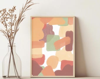 May include: Abstract art print in a light wooden frame. The artwork features overlapping shapes in shades of orange, green, and burgundy against a white background. A clear glass vase with dried plants is in the foreground.