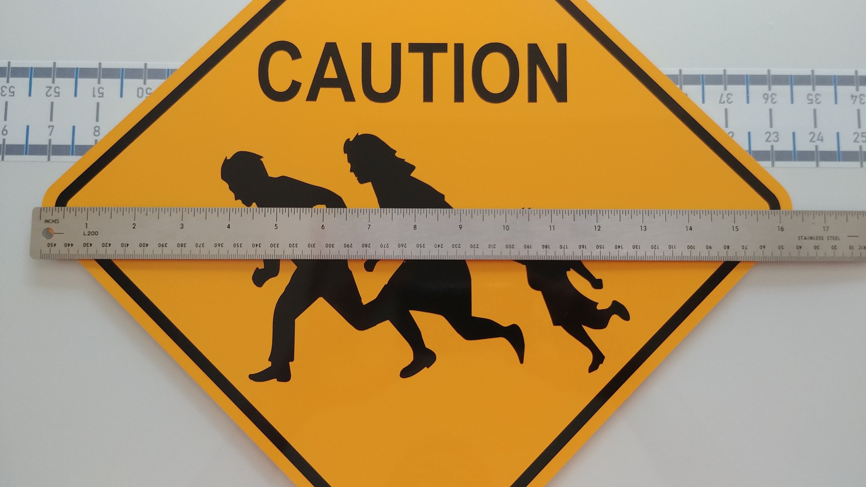 Immigrant Crossing Road Sign