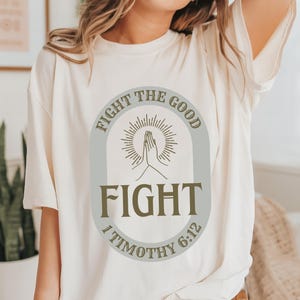 Fight the Good Fight T Shirt, Retro Boho Christian T Shirt, Bible Verse Tee, Faith Shirt, Christian Gift, 1 Timothy 6:12, Modern Jesus Tee
