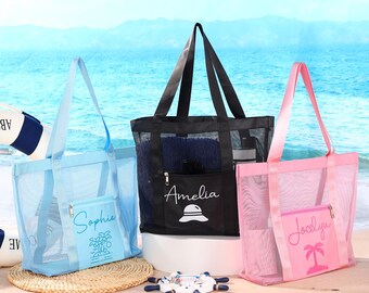 May include: Three mesh beach bags in blue, black, and pink, each with a zippered pocket and handles. The blue bag has "Sophia" and a palm tree design, the black bag has "Amelia" and a hat, and the pink bag has "Jocelyn" and a palm tree.