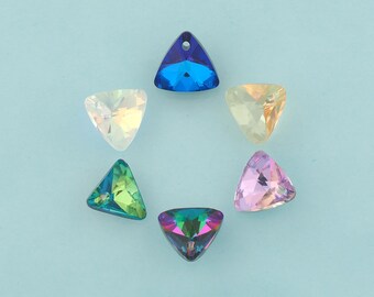 May include: A collection of six colorful, triangular crystal pendants arranged in a circular pattern. The crystals are in shades of blue, green, yellow, pink, and iridescent, each with a hole at the top for stringing. The background is a light blue.