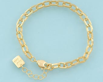 May include: A gold chain bracelet with a textured finish. The bracelet has a lobster clasp closure and a small tag with the letter "H" on it.
