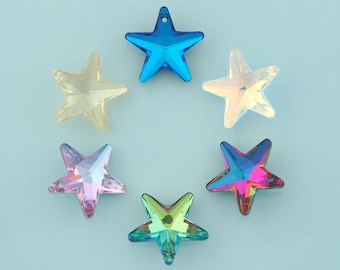 May include: Six colorful star-shaped beads in shades of blue, yellow, pink, and iridescent. Each star has a hole at the top for stringing. The beads are arranged in a circle on a light blue background.