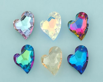 May include: Six iridescent heart-shaped crystal pendants in various colors, including pink, yellow, blue, and green. Each heart has a faceted surface and a small hole at the top for stringing. The pendants are displayed on a light blue background.