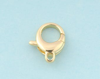 May include: Gold-toned metal lobster clasp with a spring-loaded closure. The clasp is designed for attaching jewelry or other items to a chain or cord.