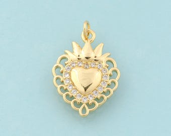 May include: Gold-tone pendant charm featuring a heart-shaped design with a crown and clear rhinestones.