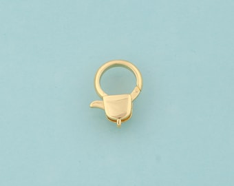 May include: Gold-toned metal lobster clasp with a round ring. The clasp is a common jewelry finding used for necklaces, bracelets, and other jewelry.
