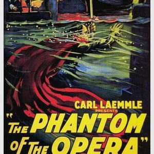 May include: A vintage movie poster for "The Phantom of the Opera" starring Lon Chaney. The poster features a dramatic image of the Phantom in a red cape, emerging from the water. The text "Carl Laemmle Presents" is at the top of the poster.