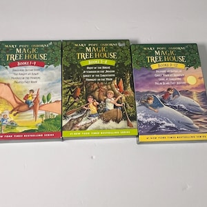 May include: Three Magic Tree House book sets by Mary Pope Osborne, covering books 1-4, 5-8, and 9-12. Each box set features colorful illustrations of children in various adventures, including riding a pteranodon, canoeing, and swimming with dolphins.