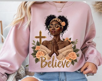 Mujer negra rezando, diseño de camiseta cristiana, chica negra adorable, texto DTF con texto Believe Gold, listo para imprimir