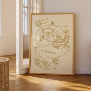 May include: A framed map of Hogwarts Castle and grounds, featuring detailed illustrations and text in a gold color. The map includes locations like Hogsmeade, the Quidditch Pitch, and the Great Lake, with a wooden frame.