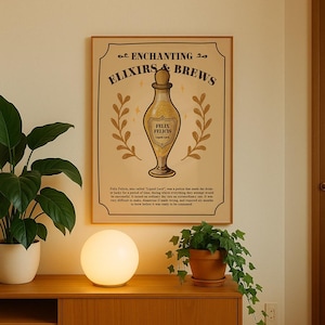 May include: A framed poster with the text "Enchanting Elixirs & Brews" and a drawing of a potion bottle. The poster has a tan background with gold accents and text that reads "Felix Felicis, Liquid Luck."