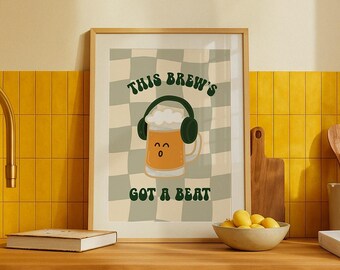 May include: A framed print with a green and white checkered background. A cartoon beer mug with headphones is in the center of the print. The text "This Brew's Got A Beat" is below the mug.