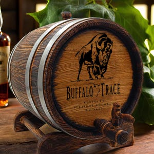 May include: A small wooden barrel with a metal band and a spigot. The barrel is decorated with a black and white image of a buffalo and the text "Buffalo Trace Kentucky Straight Bourbon Whiskey".