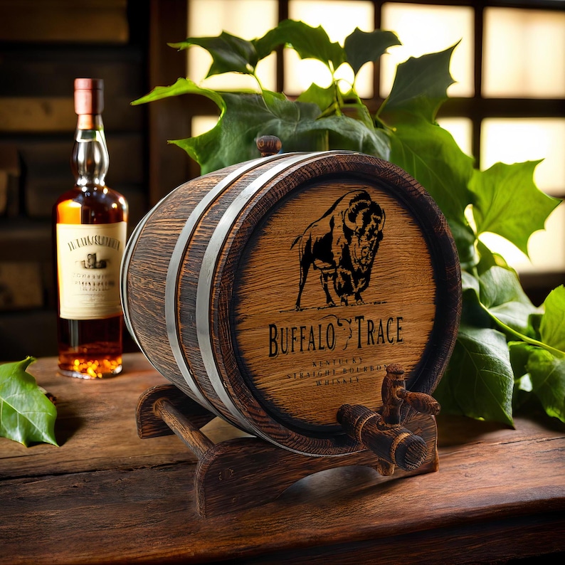 May include: A small wooden barrel with a metal band and a spigot. The barrel is decorated with a black and white image of a buffalo and the text "Buffalo Trace Kentucky Straight Bourbon Whiskey".