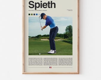 May include: A framed poster featuring the name "Spieth" in large black letters above a photograph of a golfer mid-swing. The golfer is wearing a blue shirt and dark pants on a green golf course. The poster includes text and a color bar.