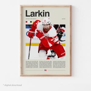 May include: A framed poster featuring a hockey player in a red and white uniform. The poster includes the name "Larkin" in large black letters, team details, and a photo of the player on the ice. The text "digital download" is at the bottom.