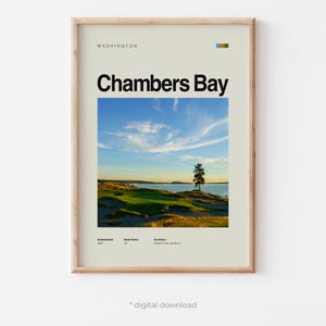May include: Framed print featuring a scenic view of Chambers Bay in Washington. The image showcases a golf course with a tree, water, and a blue sky with clouds. The print includes the text "Chambers Bay" and other details.