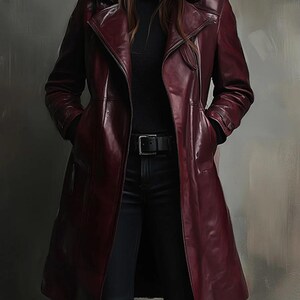 May include: A long, burgundy leather coat with a notched collar and a belt. The coat is worn over a black turtleneck and black trousers. The coat has a sleek, polished appearance and is a classic outerwear piece.