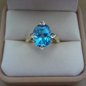 Lovely 14K Yellow Gold Oval Blue Topaz Ring with Diamond Accents