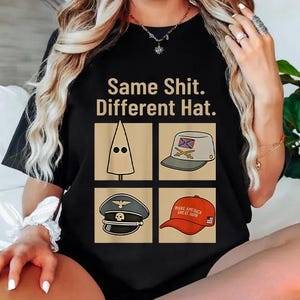 May include: Black t-shirt featuring the phrase "Same Shit. Different Hat." and four hat illustrations. The hats are a white pointed hood, a grey hat with a Confederate flag, a black military hat, and a red baseball cap.