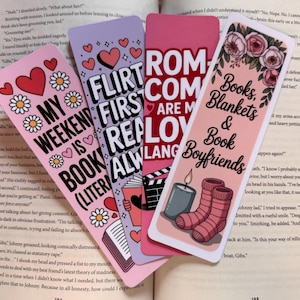 May include: Four colorful bookmarks with playful text and illustrations. Designs include hearts, flowers, and phrases like "My Weekend is Book (Literally)" and "Books, Blankets & Book Boyfriends."