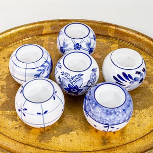 May include: A rustic wooden sign with the text "Welcome to our home" in white lettering. The sign features a distressed finish and a simple, inviting design, perfect for front door decor.